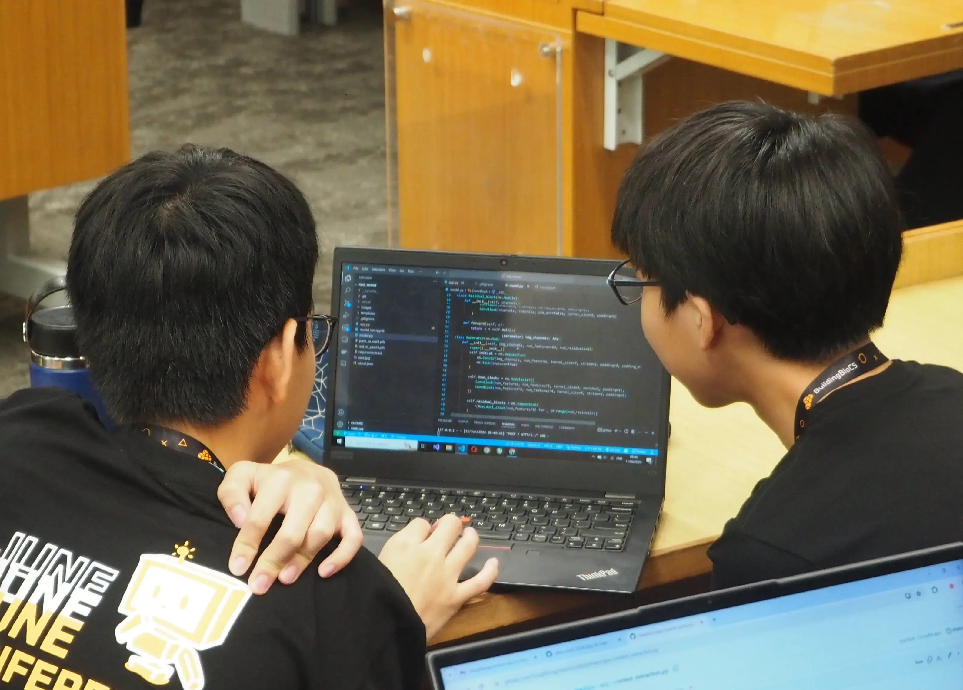 An organiser speaking at a FOSSASIA event